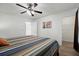 Serene bedroom boasts a comfortable bed and an adjacent closet offering ample storage at 9080 Delancey Cir, North Charleston, SC 29406
