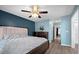 Charming bedroom with natural light, ceiling fan, and wood-look flooring at 9080 Delancey Cir, North Charleston, SC 29406