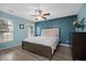 Relaxing bedroom with natural light, ceiling fan, and wood-look flooring at 9080 Delancey Cir, North Charleston, SC 29406