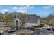 Community clubhouse with ample parking and surrounding trees at 9080 Delancey Cir, North Charleston, SC 29406