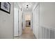 Clean, bright hallway with access to the laundry room, enhancing home accessibility at 9080 Delancey Cir, North Charleston, SC 29406