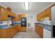 This beautiful kitchen is equipped with stainless steel appliances, wood cabinets and ample counterspace at 9080 Delancey Cir, North Charleston, SC 29406