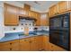 Charming kitchen features light wood cabinets and modern appliances for a cozy cooking space at 9080 Delancey Cir, North Charleston, SC 29406
