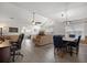 Spacious living room with vaulted ceilings, ceiling fan, a dining area, and an adjacent office area at 9080 Delancey Cir, North Charleston, SC 29406