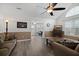 Inviting living room featuring modern flooring, a ceiling fan, and natural light from a window at 9080 Delancey Cir, North Charleston, SC 29406