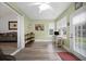 Bright sunroom featuring lots of natural light, desk, and access to the home's interior at 9080 Delancey Cir, North Charleston, SC 29406