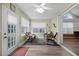 Cozy sunroom with plenty of windows and wicker furniture creating a relaxing, bright atmosphere at 9080 Delancey Cir, North Charleston, SC 29406