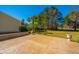 Paver patio overlooking backyard of well-maintained property on sunny day at 9408 Harroway Rd, Summerville, SC 29485