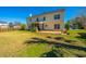 Backyard features a patio for outdoor entertaining and an open yard at 9408 Harroway Rd, Summerville, SC 29485