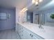 The bathroom features a double sink vanity with generous storage and an oversized mirror at 9408 Harroway Rd, Summerville, SC 29485