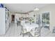 Spacious kitchen with white cabinets, a large island, and bright natural light at 9408 Harroway Rd, Summerville, SC 29485