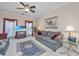Comfortable living room with neutral walls, grey sofas, and bright natural light at 9408 Harroway Rd, Summerville, SC 29485