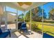 Outdoor living in screened in porch for enjoying the backyard view at 9408 Harroway Rd, Summerville, SC 29485