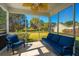 Screened porch features outdoor furniture and beautiful backyard views at 9408 Harroway Rd, Summerville, SC 29485