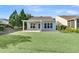 View of the large backyard from the side of the home with a covered patio at 102 Harbor Point Ct, Summerville, SC 29486