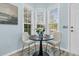 This breakfast nook is bright and airy with ample light, and features a round table and seating for two at 102 Harbor Point Ct, Summerville, SC 29486