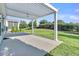 Covered patio with a ceiling fan with lush landscaping at 102 Harbor Point Ct, Summerville, SC 29486
