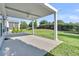 This home has a covered patio with a ceiling fan with beautiful views of the green lawn at 102 Harbor Point Ct, Summerville, SC 29486