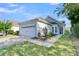 Charming single-story home features light gray siding, well-manicured landscaping, a two-car garage, and a welcoming entrance at 102 Harbor Point Ct, Summerville, SC 29486