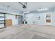 Spacious garage with overhead lighting, storage racks and utility sink provides ample space for vehicles and projects at 102 Harbor Point Ct, Summerville, SC 29486