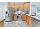 Modern kitchen features stainless steel appliances, light brown cabinetry, and hardwood-style floors for a clean, updated look at 102 Harbor Point Ct, Summerville, SC 29486