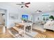 This spacious living room has wood-look flooring, recessed lighting, and flows into the dining area at 102 Harbor Point Ct, Summerville, SC 29486