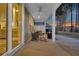 Relaxing porch with comfortable seating, ceiling fan, and a fire pit at 105 Bluff Isle Ct, Summerville, SC 29486
