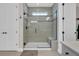 Modern bathroom with glass shower featuring a window, and stylish white vanity at 105 Bluff Isle Ct, Summerville, SC 29486