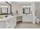 Spacious bathroom featuring dual sinks, white cabinetry, and modern lighting fixtures at 105 Bluff Isle Ct, Summerville, SC 29486