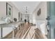 Elegant foyer with wood floors, decorative tables, and an arched doorway leading to the living area at 105 Bluff Isle Ct, Summerville, SC 29486