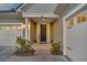 Close-up of a welcoming front entrance with a dark-colored door and an attached two-car garage at 105 Bluff Isle Ct, Summerville, SC 29486