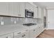 Modern kitchen with stainless steel appliances, quartz counters, and white cabinetry for seamless cooking at 105 Bluff Isle Ct, Summerville, SC 29486
