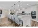 Bright kitchen boasts an island, quartz countertops, modern stainless-steel appliances, and cabinetry at 105 Bluff Isle Ct, Summerville, SC 29486