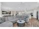 Spacious living room boasts modern decor, open layout, and flows seamlessly into the kitchen and dining area at 105 Bluff Isle Ct, Summerville, SC 29486