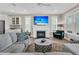 Comfortable living room with a fireplace, large sectional couch, and views of the exterior at 105 Bluff Isle Ct, Summerville, SC 29486