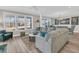 Inviting living room featuring neutral tones, expansive windows, and a comfortable sectional couch at 105 Bluff Isle Ct, Summerville, SC 29486