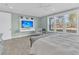 Well-lit main bedroom with a TV and large windows overlooking the outdoors at 105 Bluff Isle Ct, Summerville, SC 29486