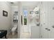 Well-lit bathroom with white fixtures, neutral tones, and functional storage solutions at 107 Nutmeg Way, Summerville, SC 29485