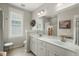 Bright bathroom featuring a double vanity, neutral color scheme, and natural light at 107 Nutmeg Way, Summerville, SC 29485