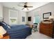 Inviting bedroom with ample sunlight, a comfortable bed, and classic wooden furnishings at 107 Nutmeg Way, Summerville, SC 29485