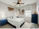 Cozy bedroom with ceiling fan, blue accent furniture, and natural light from the window at 107 Nutmeg Way, Summerville, SC 29485