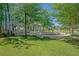 Relaxing community park with pergola-covered seating areas surrounded by lush green space and trees at 107 Nutmeg Way, Summerville, SC 29485