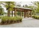 The brick and wood pavilion offers a cool shaded space with views of the lake at 107 Nutmeg Way, Summerville, SC 29485