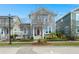 Charming two-story home with a red front door, white trim and porch swing at 107 Nutmeg Way, Summerville, SC 29485