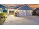 Spacious two-car garage with covered storage and workshop area, offering ample space for vehicles and projects at 107 Nutmeg Way, Summerville, SC 29485
