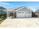Two car garage with covered space for projects and organization; perfect for storage and hobbies at 107 Nutmeg Way, Summerville, SC 29485