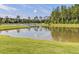 Scenic view of a golf course alongside a tranquil pond, perfect for golf enthusiasts and nature lovers at 107 Nutmeg Way, Summerville, SC 29485