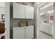 Functional hallway area with built-in storage cabinets and access to a well-lit bathroom at 107 Nutmeg Way, Summerville, SC 29485