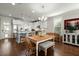 Eat-in kitchen features a wooden dining table, modern white cabinets, stainless steel appliances, and granite counters at 107 Nutmeg Way, Summerville, SC 29485