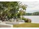 Lakeside outdoor seating area with an array of chairs and benches for relaxing outdoors at 107 Nutmeg Way, Summerville, SC 29485